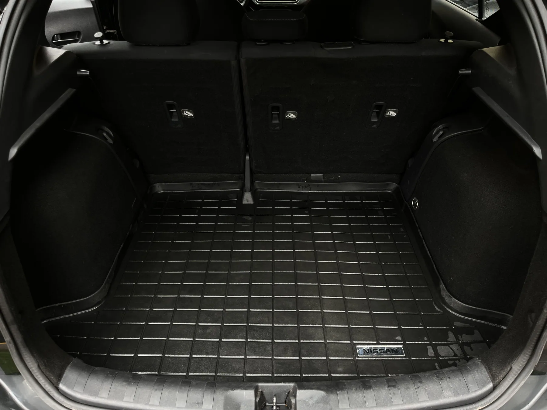 Clean SUV cargo area with fitted rubber mat