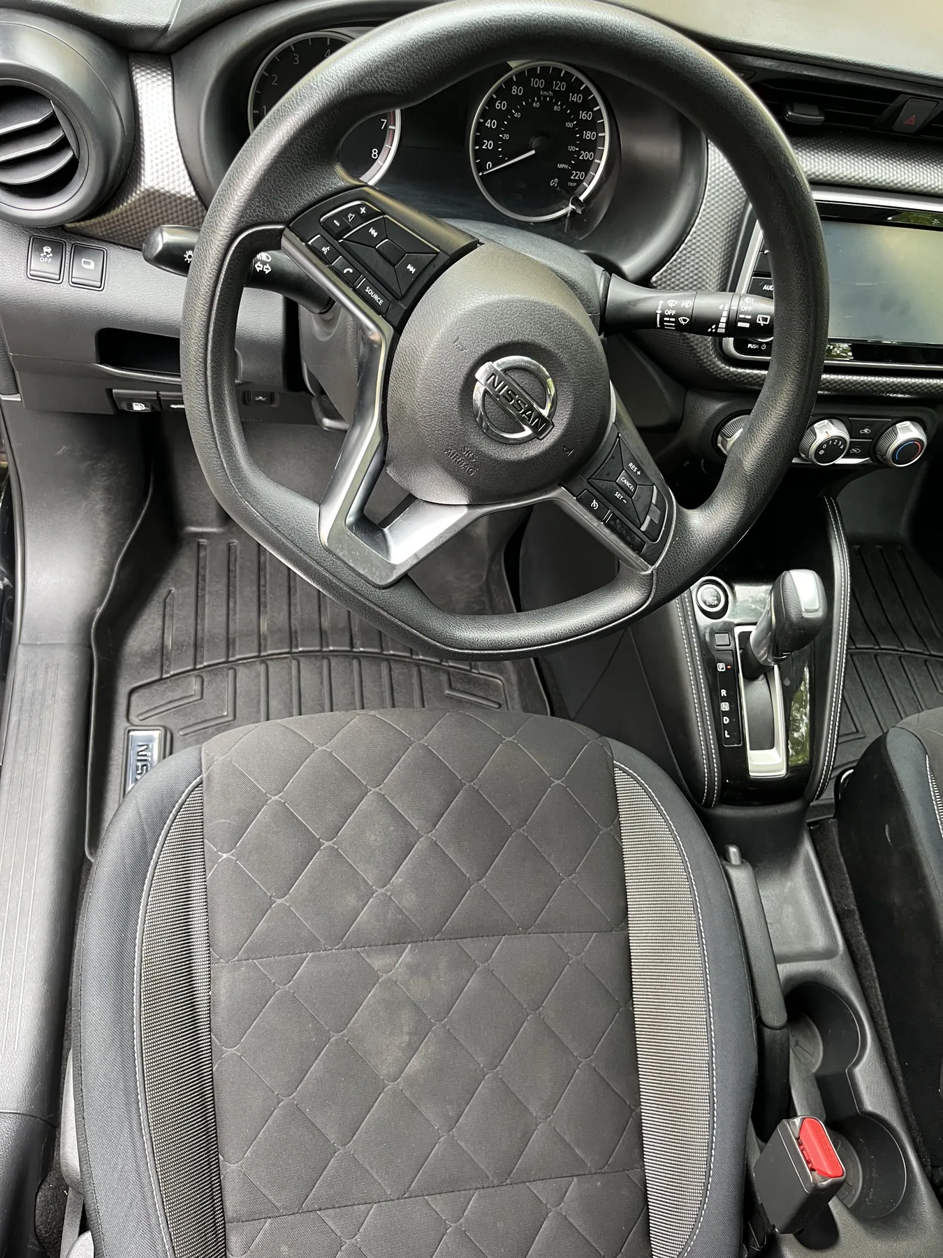 Detailed driver area with clean steering wheel and seats