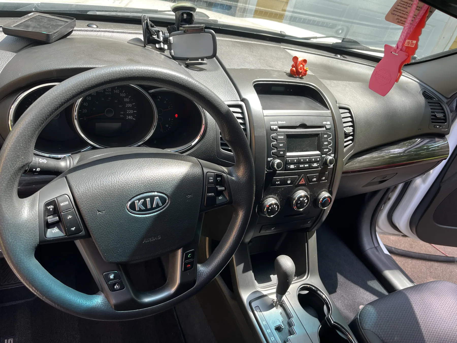 Clean Kia dashboard, steering wheel and front seats
