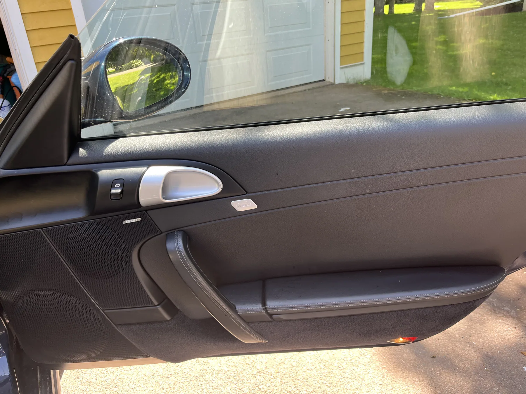 Clean black Porsche door panel and sill